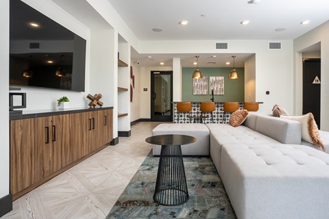 a living room with a white couch and a table